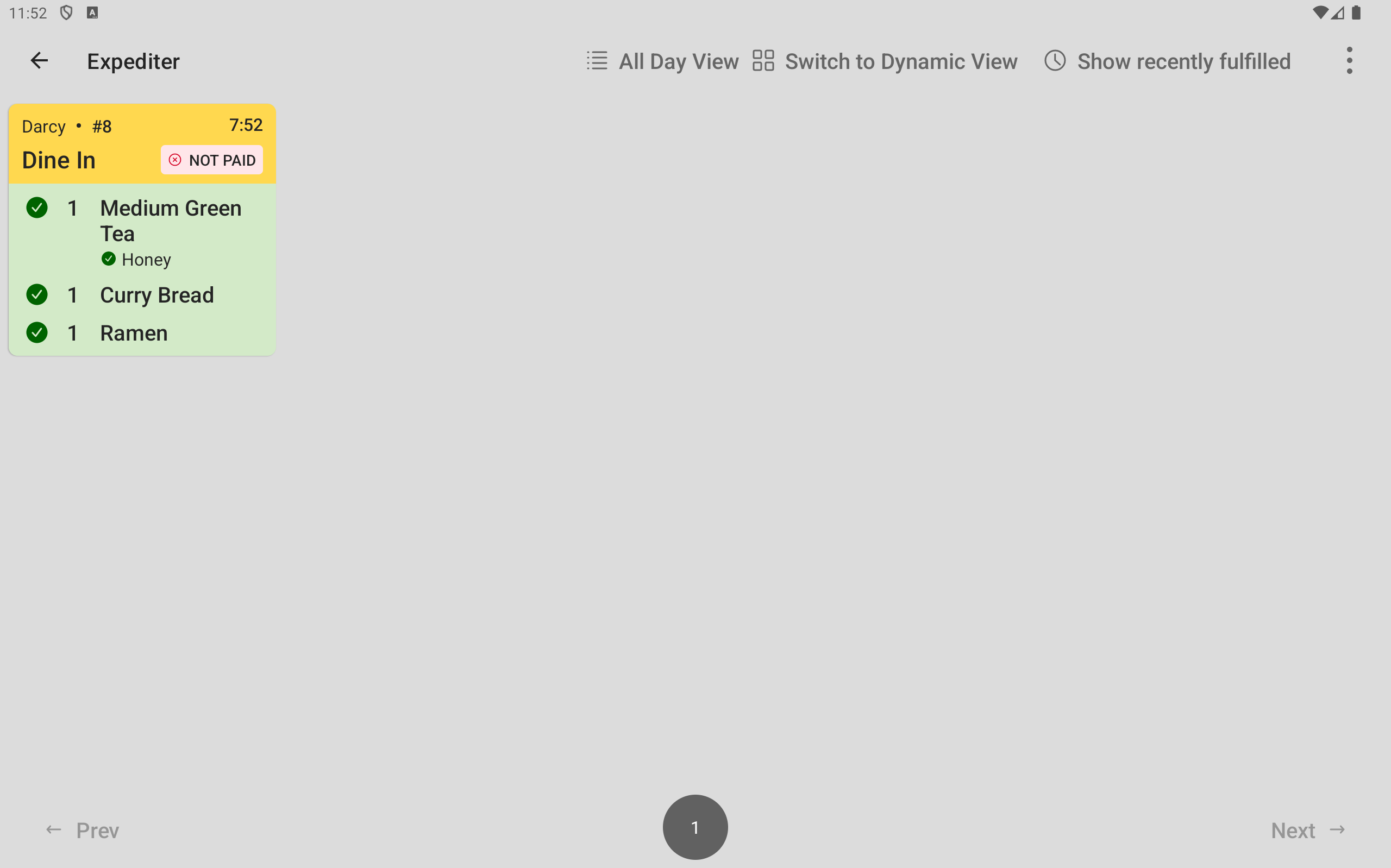 The expediter KDS device showing a ticket with all items fulfilled.