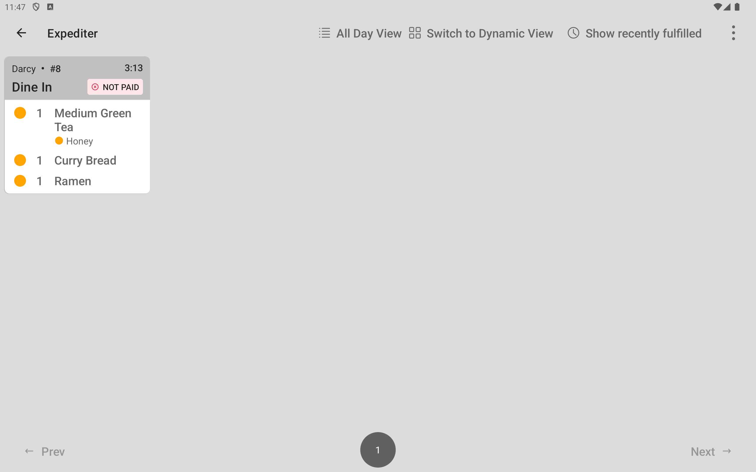 The expediter KDS device showing a ticket with the started Food prep station items which have the partial fulfillment icon.