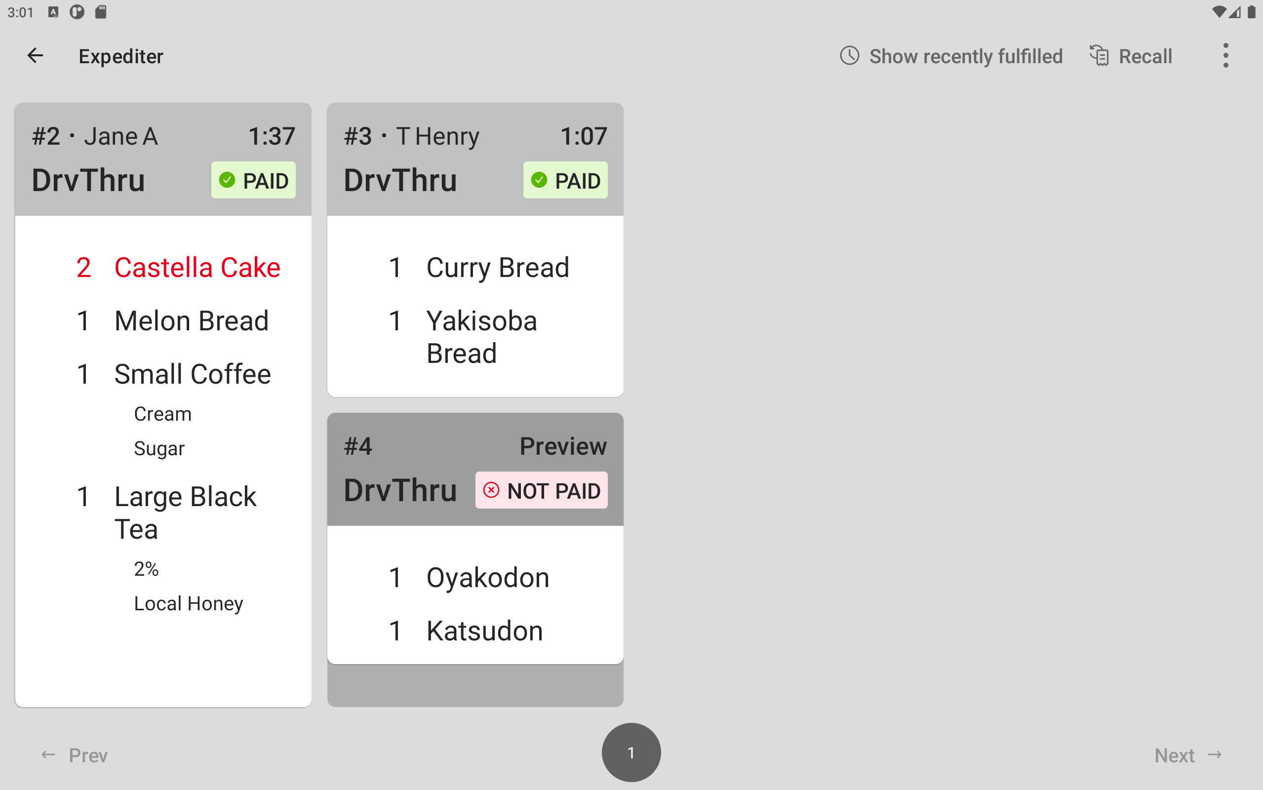 An example of grid view on an expediter KDS device with two fired tickets and one preview ticket, using the Medium Tickets size.