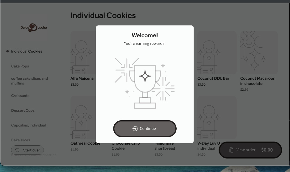 A kiosk screen, showing the loyalty program sign-up confirmation.